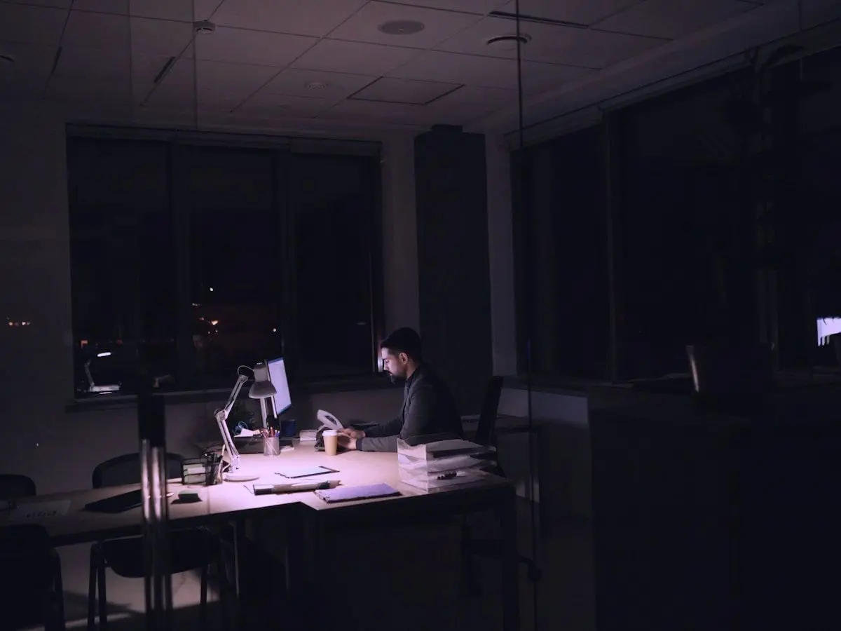 An outreach specialist working late at a desk